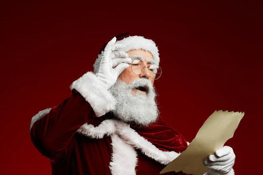 Santa reading a letter.